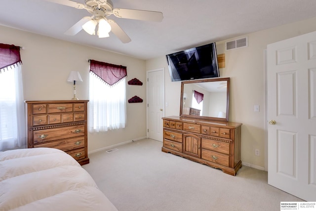 bedroom featuring visible vents, a ceiling fan, carpet, and baseboards