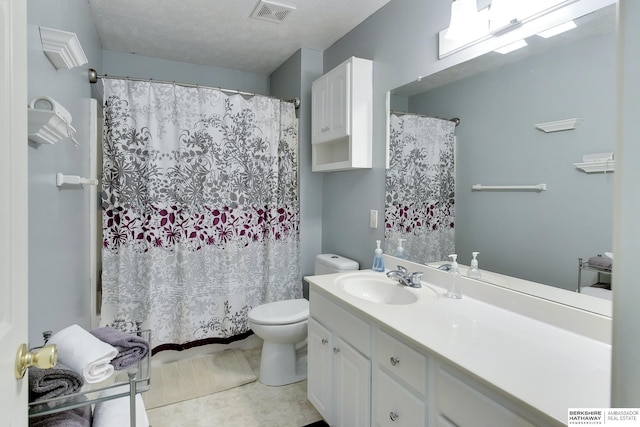 bathroom with vanity, shower / bath combo, toilet, and visible vents