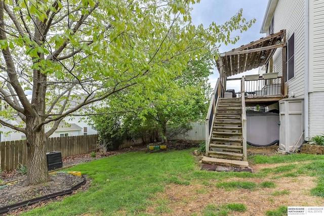 view of yard featuring a fenced backyard, central air condition unit, a deck, and stairway