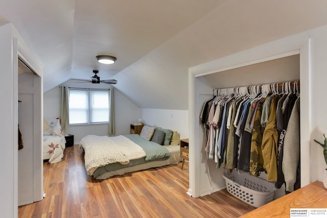 bedroom featuring vaulted ceiling and wood finished floors