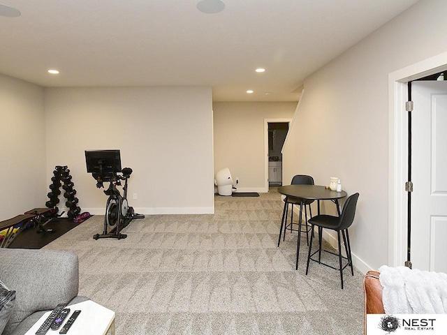 exercise room with recessed lighting, carpet, and baseboards