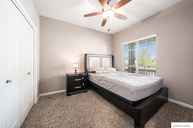 bedroom with baseboards, a closet, and light colored carpet