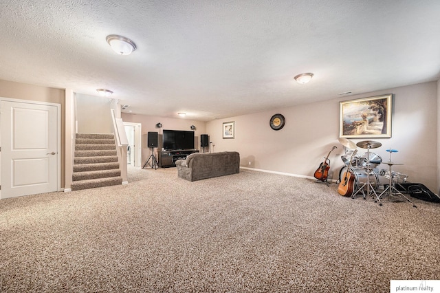 carpeted living room with a textured ceiling, baseboards, and stairway