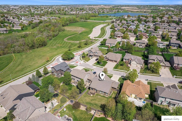 birds eye view of property featuring a water view, golf course view, and a residential view