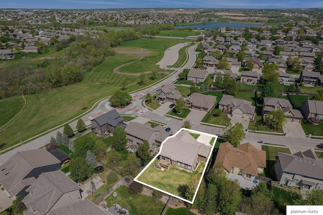 bird's eye view featuring a residential view and a water view