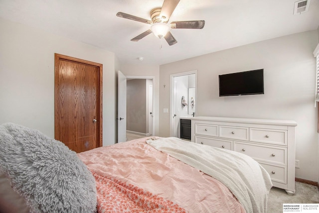 bedroom featuring ceiling fan, visible vents, baseboards, a closet, and light carpet