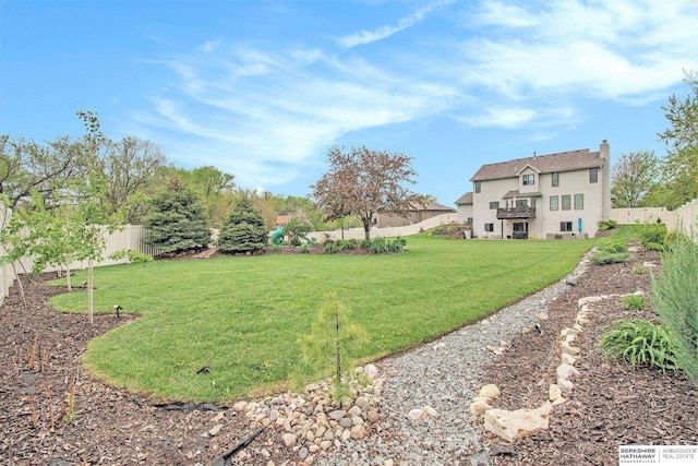 view of yard featuring a fenced backyard and a playground