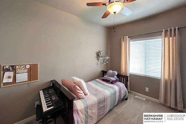 bedroom featuring carpet flooring, a ceiling fan, baseboards, and visible vents
