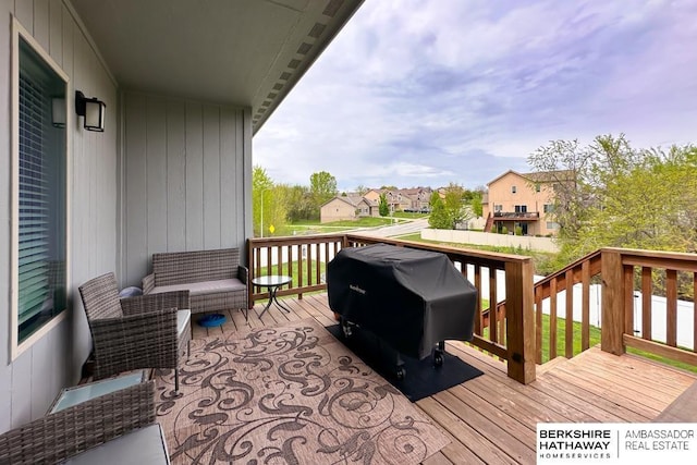 wooden deck featuring a residential view and area for grilling