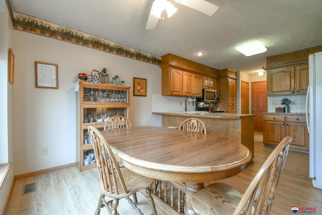 dining room with ceiling fan, light wood-style flooring, recessed lighting, baseboards, and visible vents