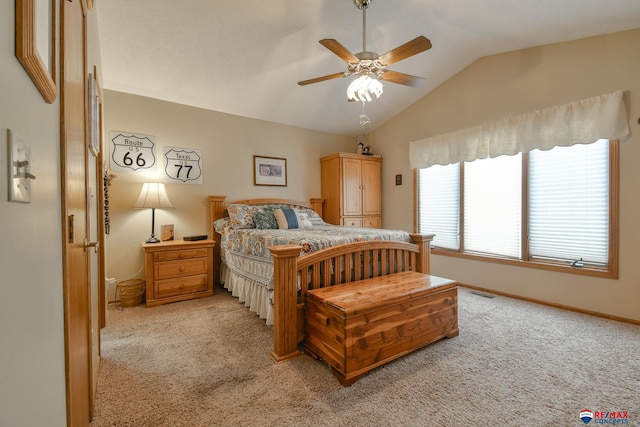 bedroom featuring light colored carpet, baseboards, vaulted ceiling, and visible vents