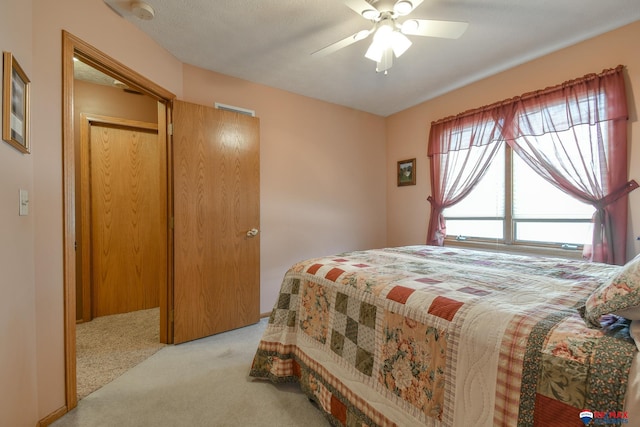 carpeted bedroom featuring a ceiling fan