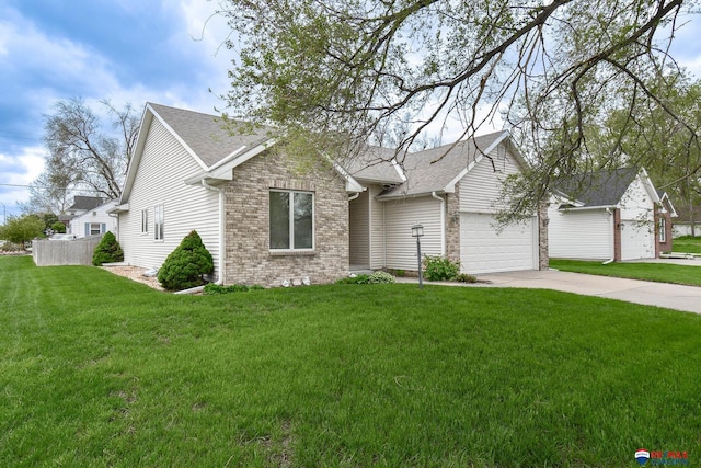 ranch-style home with concrete driveway, brick siding, an attached garage, and a front yard