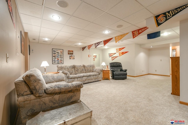 living area featuring recessed lighting, baseboards, a paneled ceiling, and carpet