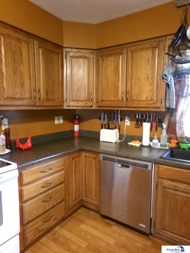 kitchen with stainless steel dishwasher, brown cabinetry, white electric stove, and light wood finished floors