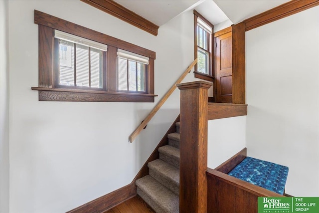 stairway featuring baseboards