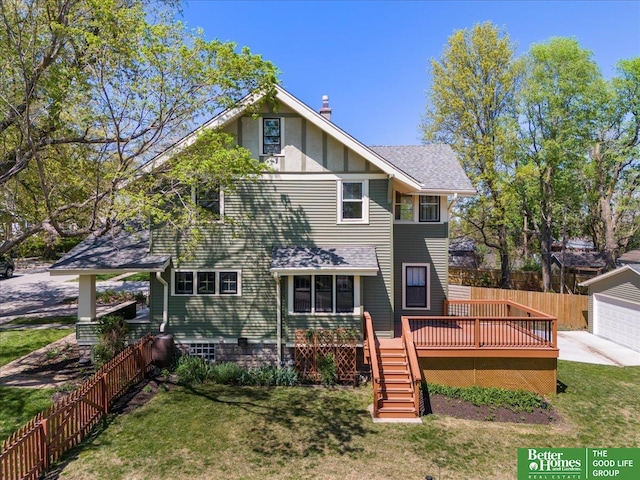 back of house featuring a yard, fence, a wooden deck, and stairs