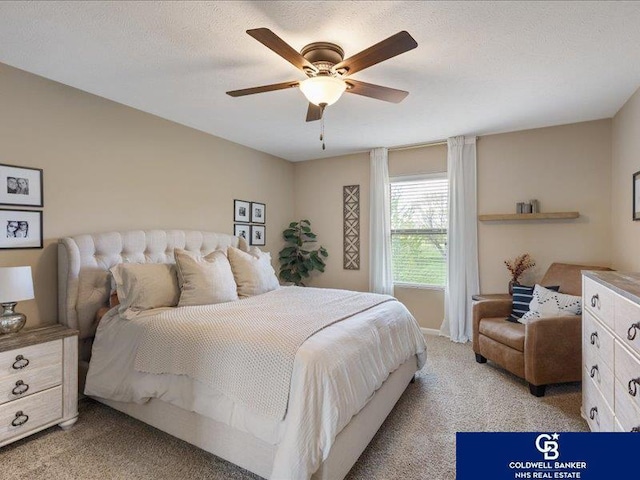 bedroom with ceiling fan and light colored carpet