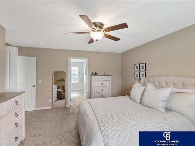 bedroom with baseboards, a ceiling fan, and light colored carpet