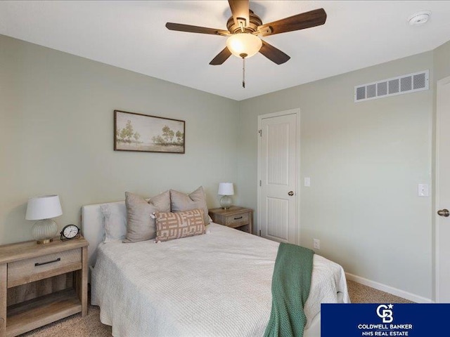 carpeted bedroom with a ceiling fan, baseboards, and visible vents