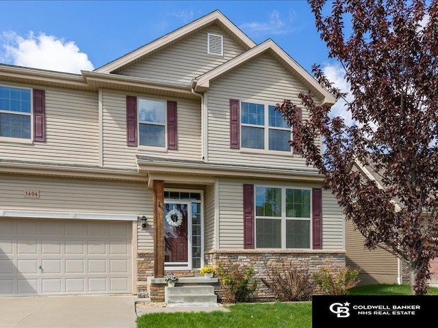 view of front of house featuring an attached garage and concrete driveway