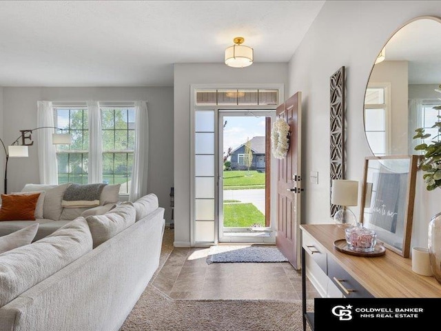 entrance foyer featuring arched walkways and baseboards