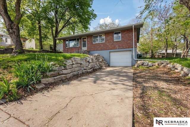 ranch-style house with brick siding, a garage, fence, and driveway