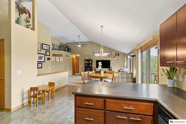 kitchen featuring dark countertops, ceiling fan, a peninsula, open floor plan, and lofted ceiling