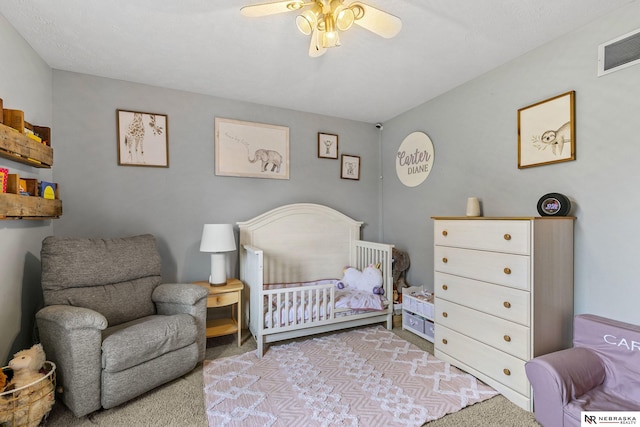 bedroom featuring visible vents and carpet
