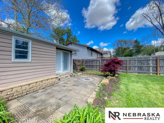 view of yard with a fenced backyard and a patio area