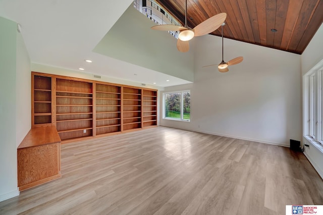 unfurnished living room with baseboards, a ceiling fan, light wood-style flooring, and recessed lighting