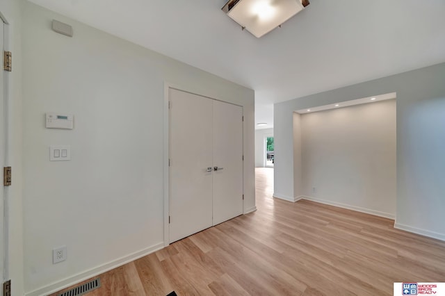 unfurnished bedroom with baseboards, recessed lighting, light wood-style flooring, and visible vents