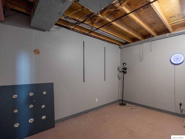 unfinished below grade area featuring baseboards