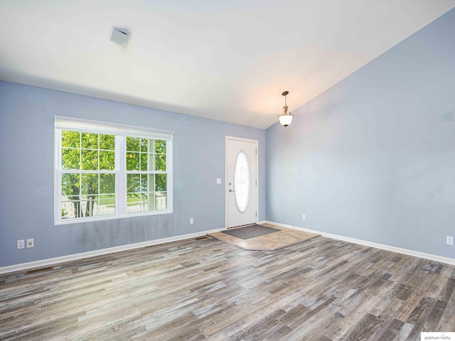 entryway featuring wood finished floors and baseboards