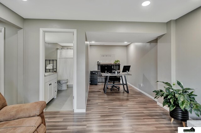 office area featuring recessed lighting, baseboards, and wood finished floors