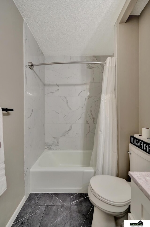 full bathroom featuring vanity, toilet, a textured ceiling, shower / bath combination with curtain, and marble finish floor