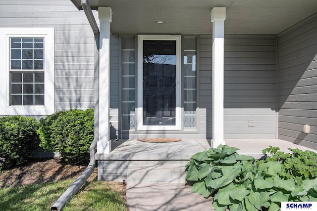 property entrance featuring covered porch