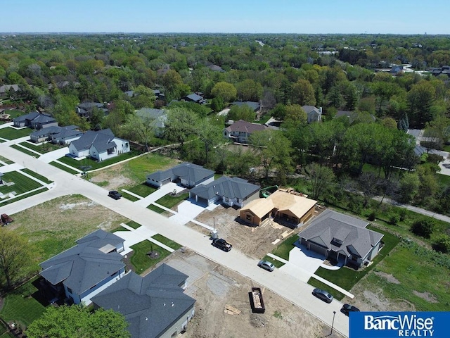 bird's eye view with a residential view and a wooded view