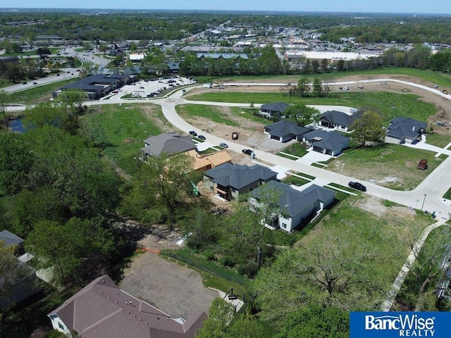birds eye view of property with a residential view