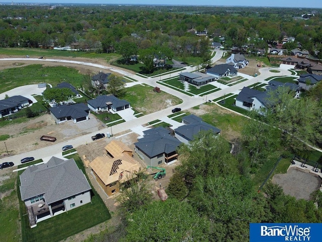 birds eye view of property with a residential view
