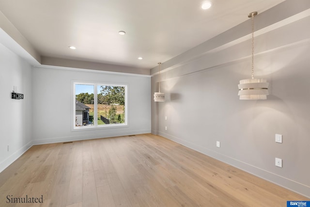 spare room with recessed lighting, baseboards, and light wood-type flooring