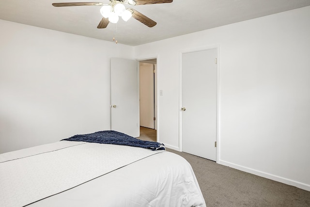bedroom featuring baseboards, light carpet, and a ceiling fan