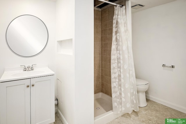 bathroom with vanity, baseboards, a shower stall, and toilet