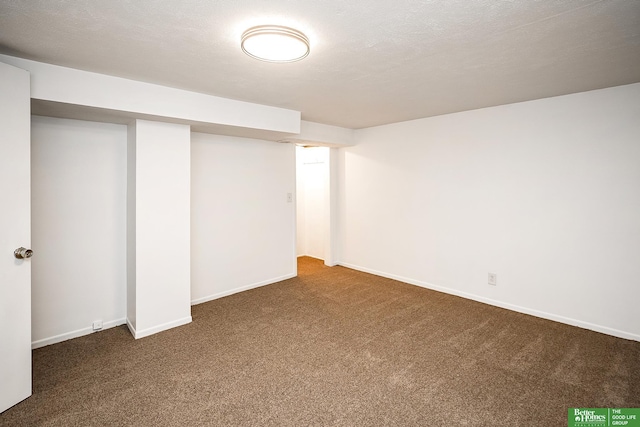 finished below grade area featuring carpet flooring and baseboards