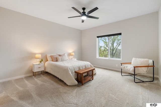 carpeted bedroom featuring baseboards and a ceiling fan