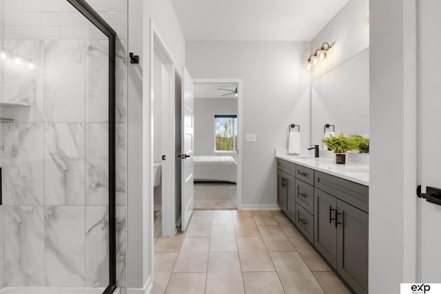 ensuite bathroom with a sink, a shower stall, double vanity, and connected bathroom