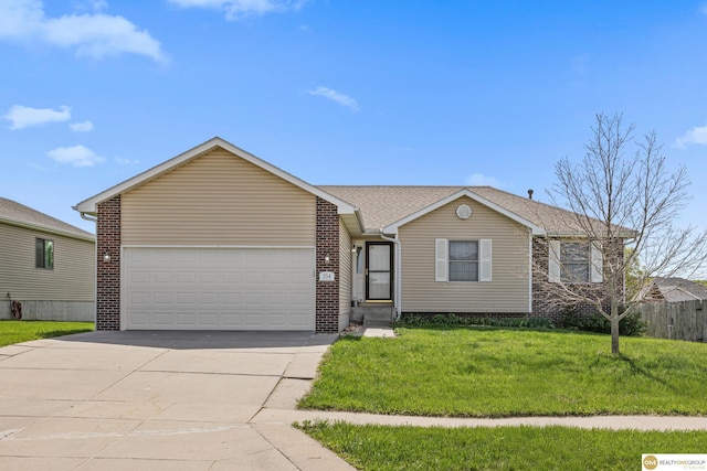 554 Shawnee Blvd, Tecumseh, NE 68450 - ranch-style home with concrete driveway, an attached garage, a front yard, and brick siding