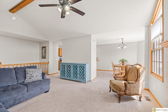 554 Shawnee Blvd, Tecumseh, NE 68450 - living room featuring ceiling fan, light colored carpet, a chandelier, and baseboards