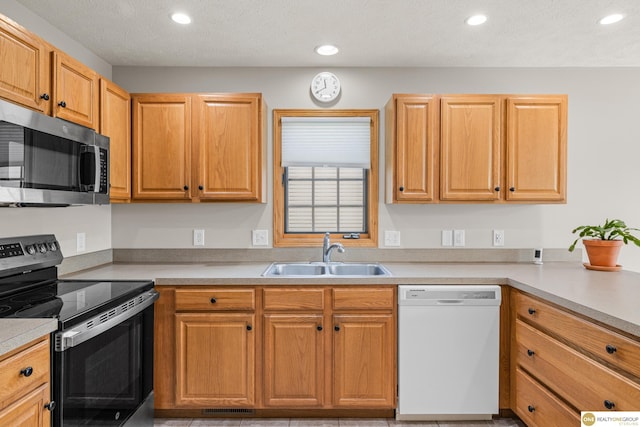 554 Shawnee Blvd, Tecumseh, NE 68450 - kitchen featuring appliances with stainless steel finishes, a sink, recessed lighting, and light countertops