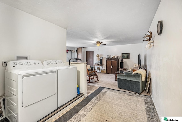 laundry area featuring separate washer and dryer, laundry area, and a ceiling fan